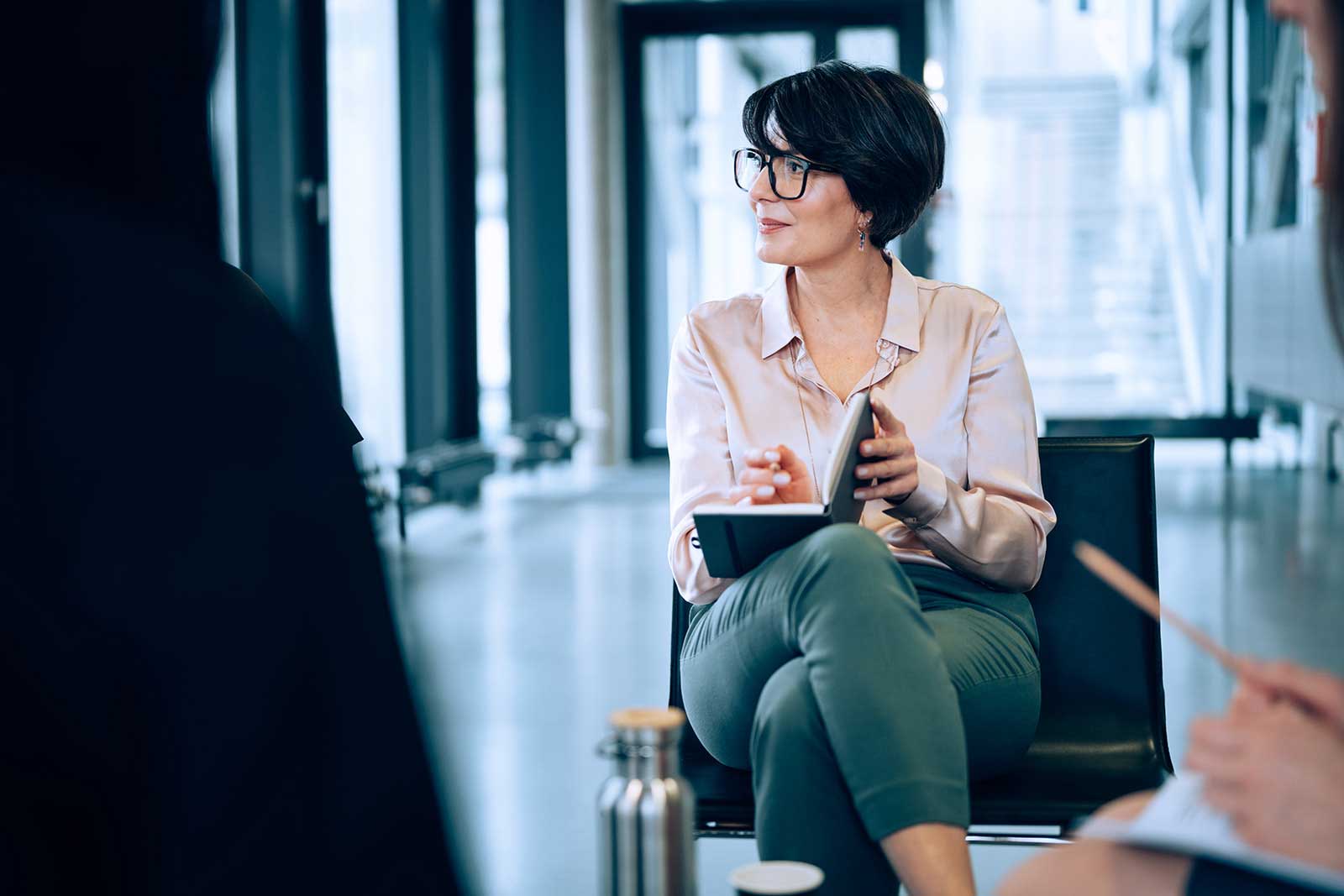 Female manager listens to her employees